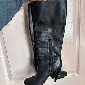 Sleek Black Leather Knee-High Heeled Boots with Side Zip